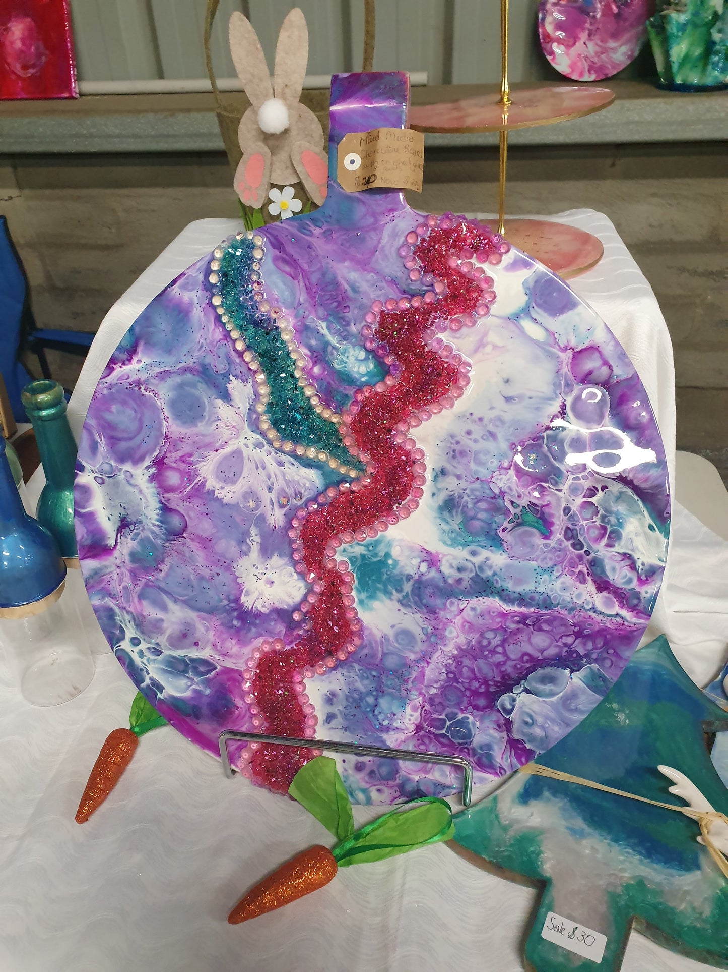 Large charcuterie board with rivers of glass chips and beads
